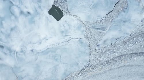 Bird's Eye View Of Frozen Glacial Lake In Winter In Iceland. - aerial shot