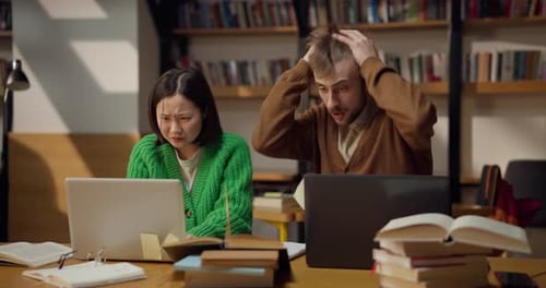 The Guy Grabs His Head and Doesnt Know What to Do While Trying to Solve a Problem with His Female