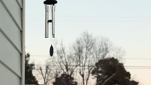 Wind Chime Swaying Gently on Winter Day