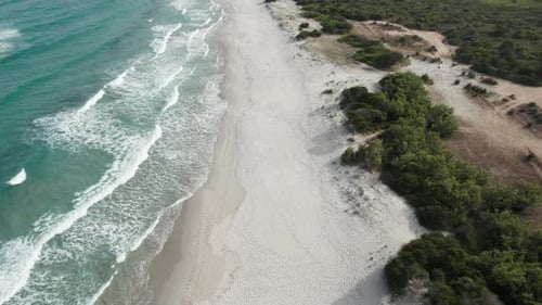 (Top down view) Aerial view drone over beach sea with gentle sea waves. Beach sand and amazing sea.