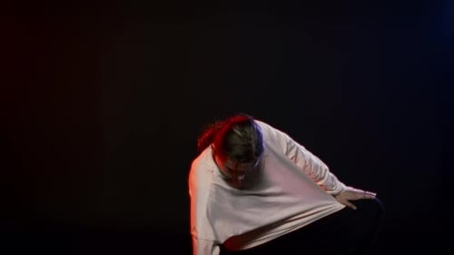 Suffering Woman Dancing in Mysterious Darkness Portrait in Motion in Studio Crazy Face of Beautiful