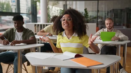 Class Lesson in School University College Lecture Classmates Sitting in Classroom African American
