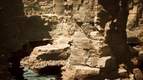 Beautiful Red River and Shores of Colored Sandstone