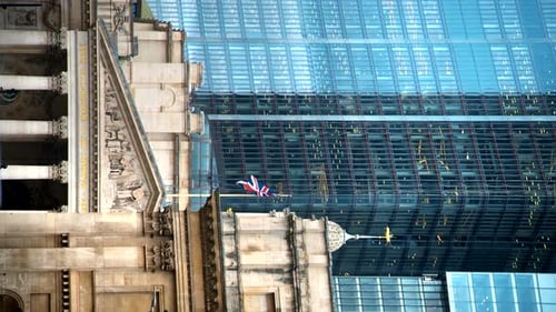 Vertical view of The Royal Exchange, classic building and skyscraper on the background in London Cit