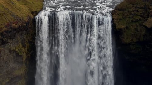Aerial View of a Skogafoss Waterfall in Iceland panning down.