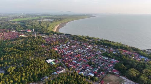 Aerial drone view of kampung Kuala Muda coastal village