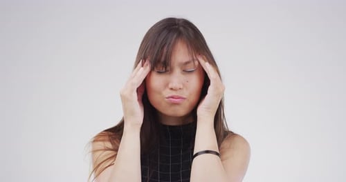 Young Woman Massaging Temples with Headache