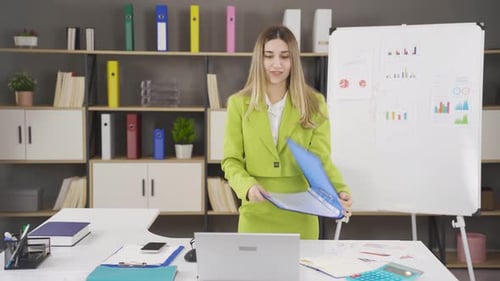Woman Celebrating Business Success in Office