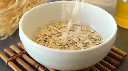 Slow Motion of Falling Roasted Oats Flakes in a Bowl