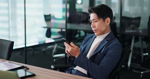 Business, typing and Japanese man with smartphone, internet and connection in modern office
