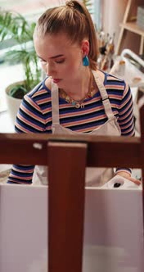 Woman Painting on Canvas Indoors in Art Studio