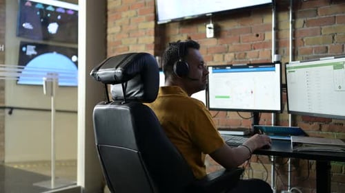 Male Customer Service Representative Working at Computers in Office 3539 Years