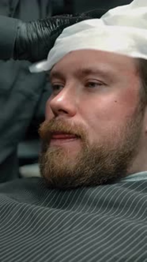 Adult Gets Cloth at Barbershop Close Up