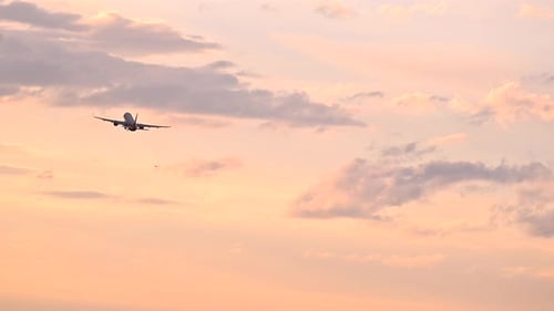 Huge Airplane Jet Take Off From Airport Landing Zone at Beautiful Sunset Clouds Sky Super Slow