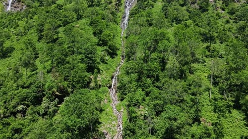 Majestic Waterfall Amid Verdant Hills - A Tranquil Scenic Escape, Austria, Drone
