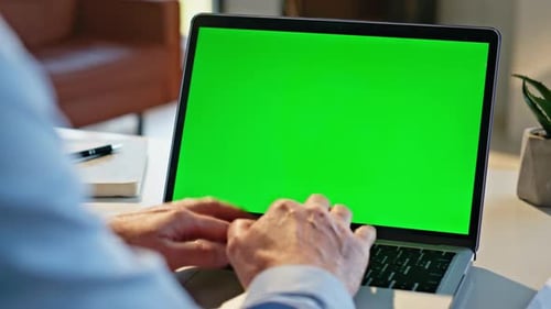 Typing on Laptop with Green Screen