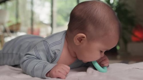 Cute baby self soothing with teething toy