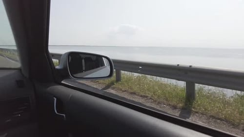 Crossing the river by the bridge inside car POV