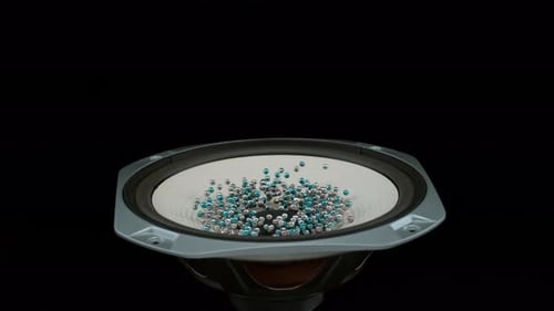 Speaker Cone with Bouncing Spheres on Black Background