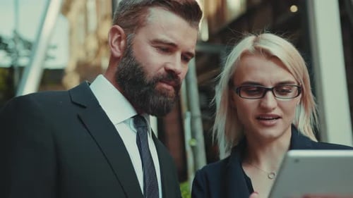 Close Up Face Business Man and Woman Talking Standing and Use Tablet Computer Together at Outdoor