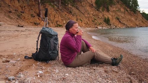 Hiking Tourism Adventure Backpacker Woman Resting After Hiking Looking at Beautiful View Hiker Girl