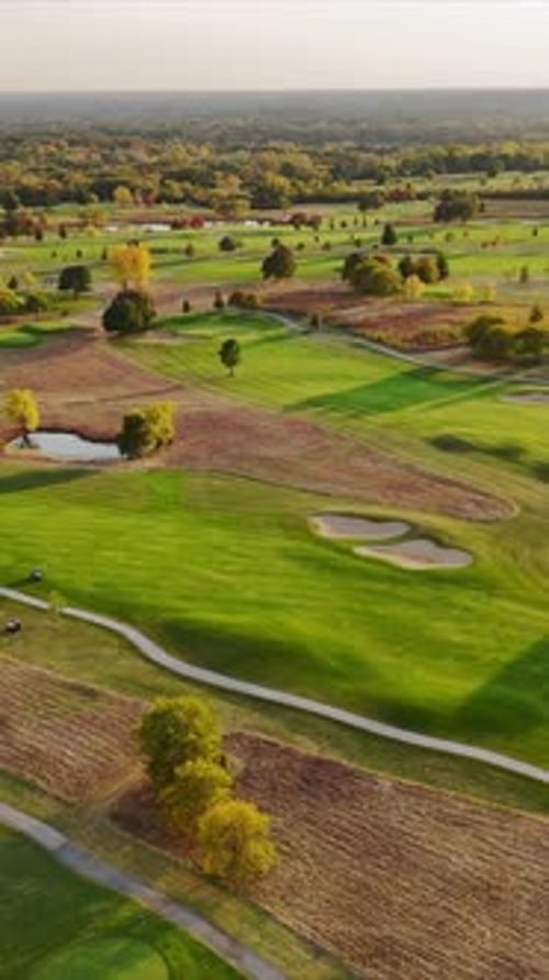 Aerial View of a Lush Golf Course with Water Features A Scenic Aerial View of a Green Golf Course