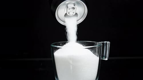 Harmful Soda with High Sugar Content, Concept, White Sugar Is Poured from a Can Instead of Soda.