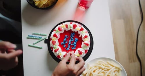 Preparing and decorating birthday cake for a party