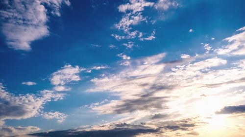 Cirrus Clouds Move in the Blue Sky Along with the Sun Timelapse
