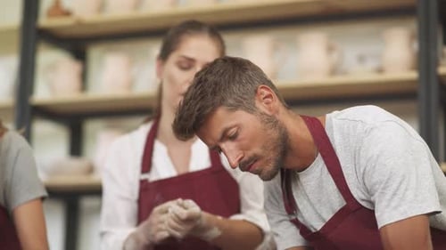 Pottery Workshop Pretty Woman Make a Workshop on Pottery Modeling for a Young Couple Production of