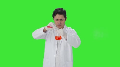 Confused Indian scientist mixing chemicals for experiment Green screen