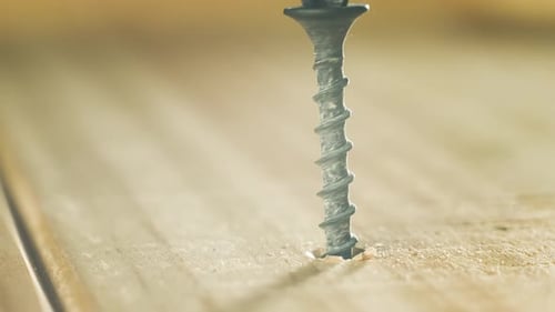 Closeup Self Tapping Screw Twisting Into Wood During Repair Macro View Hardware Fastener Rotating in