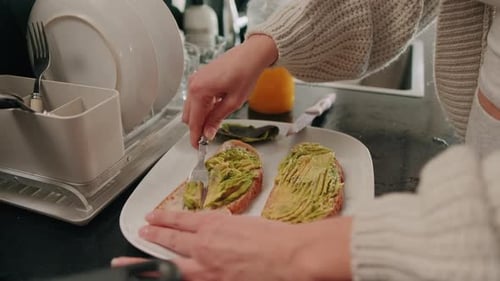 Preparing Avocado Toast in Kitchen