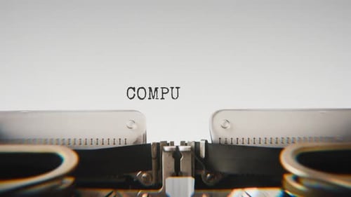 Old mechanical typewriter typing Computer Vision in a close-up view.