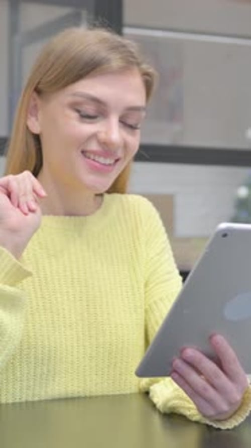 Smiling Woman Video Calling on Tablet Device