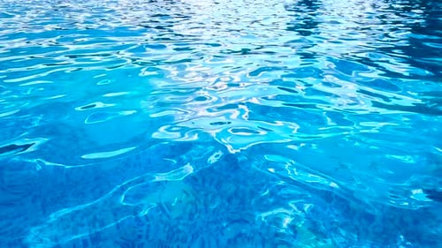 Calm Azure Water Surface in a Blue Pool