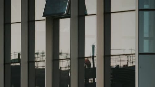 Construction Reflections in City Building Windows