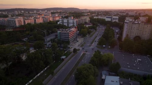 Aerial View Of Few Vehicles Driving In The City Of Krakow At Sunset In Poland.