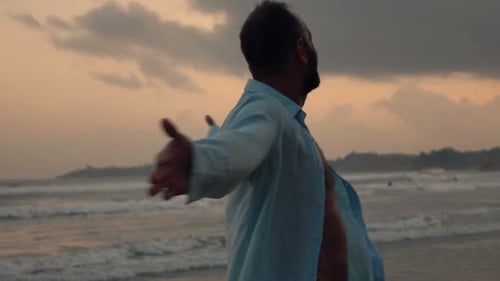 Happy Man Turning Around on Beach During Sunset Super 240