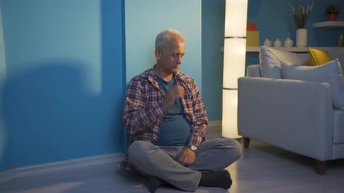 Man Sitting on the Floor Relaxing