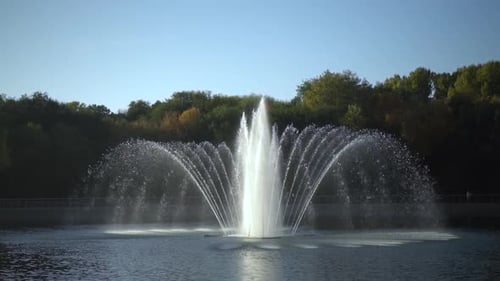 A Fountain in a Park in the Middle of a Lake Autumn View of the Fountain Slow Motion