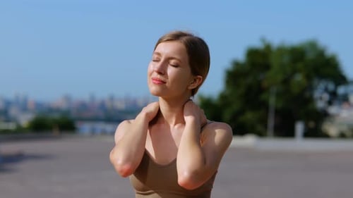 Athletic Young Woman Feeling Pain in Her Neck After Workout Outdoors in the City Lady Massaging Neck