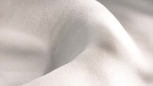 Smooth White Fabric Flows Gently Creating Soft Curves and Folds Illuminated By a Subtle Light Source