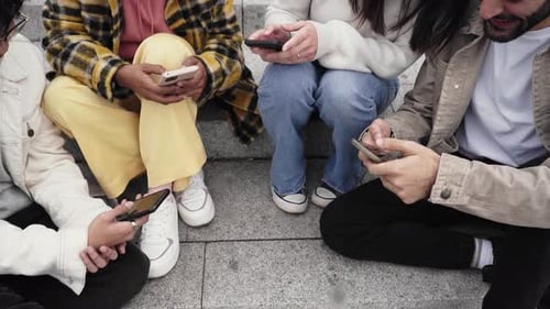 Close Up of People Hands Sharing Content on Social Media Network with Smartphone Friends Group