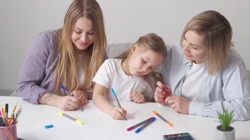 Family Drawing Together at a Table