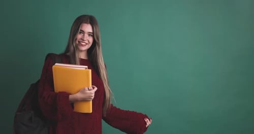 Smiling Student Points to Copy Space
