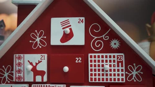 Wooden Tree Advent Calendar Decorated and Nutcracker Soldier Toys With Bokeh Blured BackgrWooden Tre