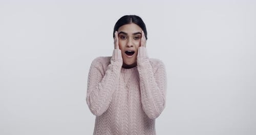 Woman, surprise face and happy in studio with excitement, announcement and deal by white background