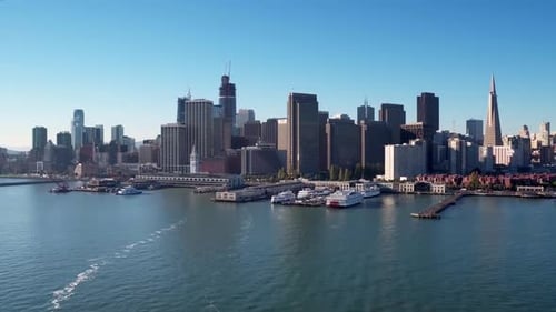 Aerial View Of Ships Docked In San Francisco Bay With Skyline In Background