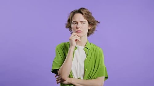 Young Woman Gets an Idea and Smiles